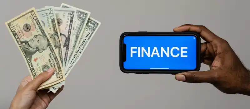 Image depicting currency and finance concept with hands holding cash and a smartphone.