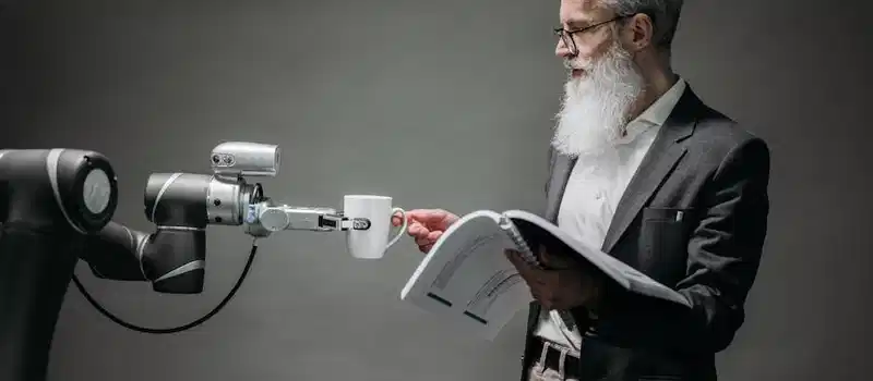 A scientist interacts with a robot helper, demonstrating modern technological innovation.