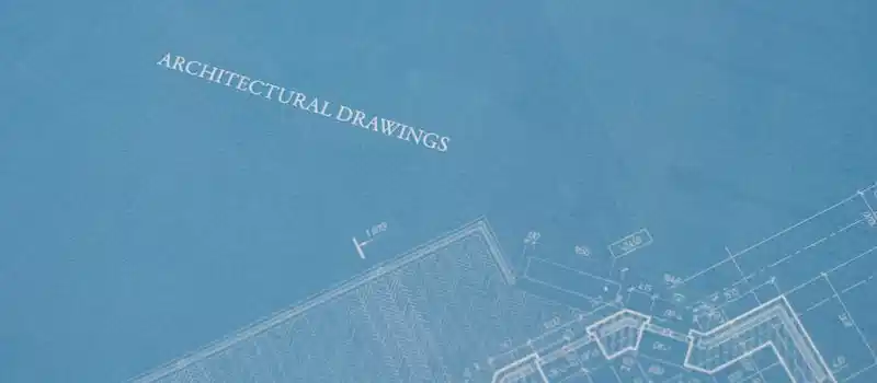 Close-up view of architectural blueprint with technical drawings.