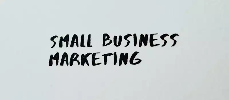 Text 'Small Business Marketing' written on white paper for creative use.