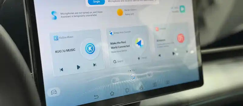 Modern car dashboard featuring a digital touchscreen interface with multiple apps.