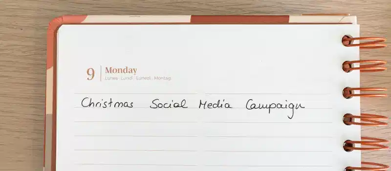Planner page with note for a Christmas social media campaign.
