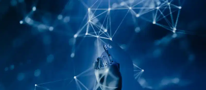 A robotic hand reaching into a digital network on a blue background, symbolizing AI technology.