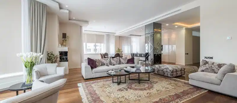 Spacious, modern living room with elegant decor and plush furniture.