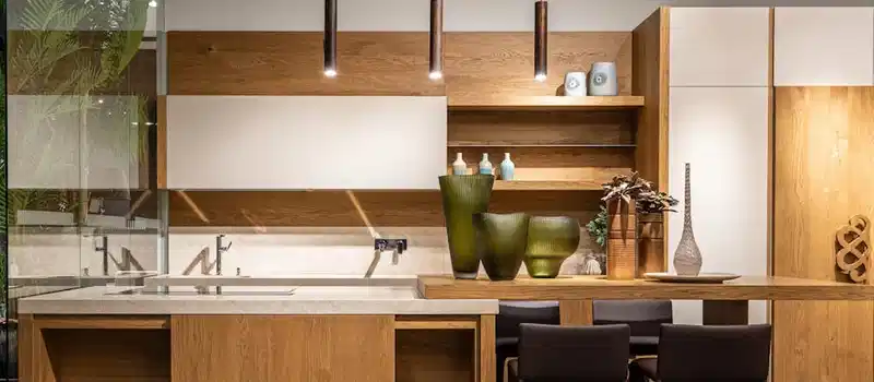 Explore this elegant modern kitchen featuring wooden cabinets and minimalist decor.