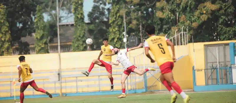 Action-packed soccer game at Jakarta stadium with players in motion captured in a lively setting.