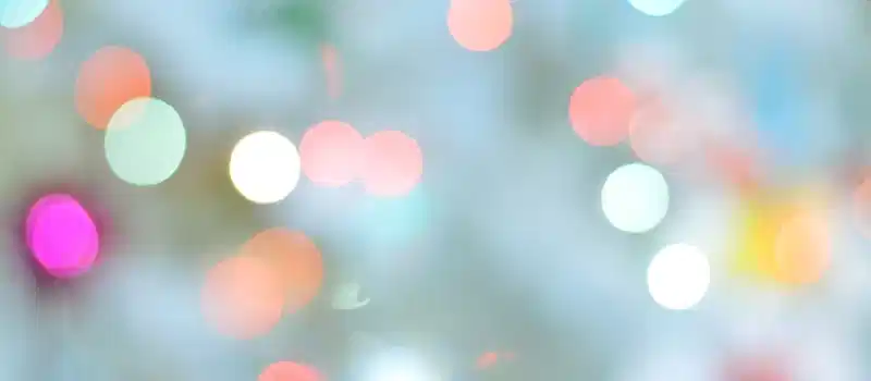 A dreamy bokeh background with colorful blurred lights creating a serene atmosphere.