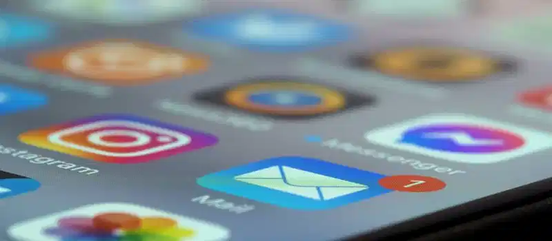 Detailed close-up of smartphone screen displaying various app icons and notifications.