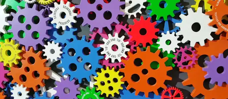 A colorful arrangement of gears symbolizing creativity, innovation, and machinery in vibrant colors.