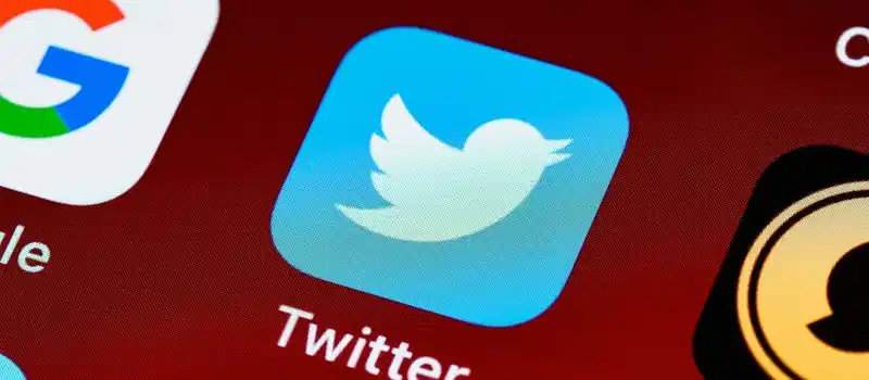 Detailed close-up image of popular social media icons on a smartphone screen.