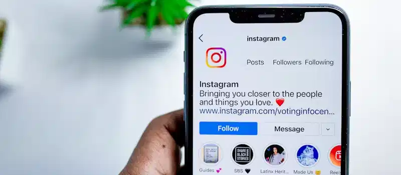 Close-up of a smartphone displaying the Instagram app, emphasizing social media connection.