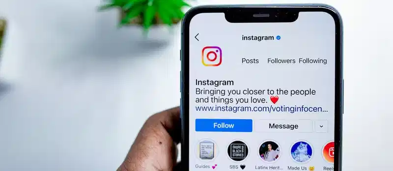 Close-up of a smartphone displaying the Instagram app, emphasizing social media connection.